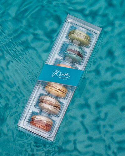 Packaged french macarons floating on a pool