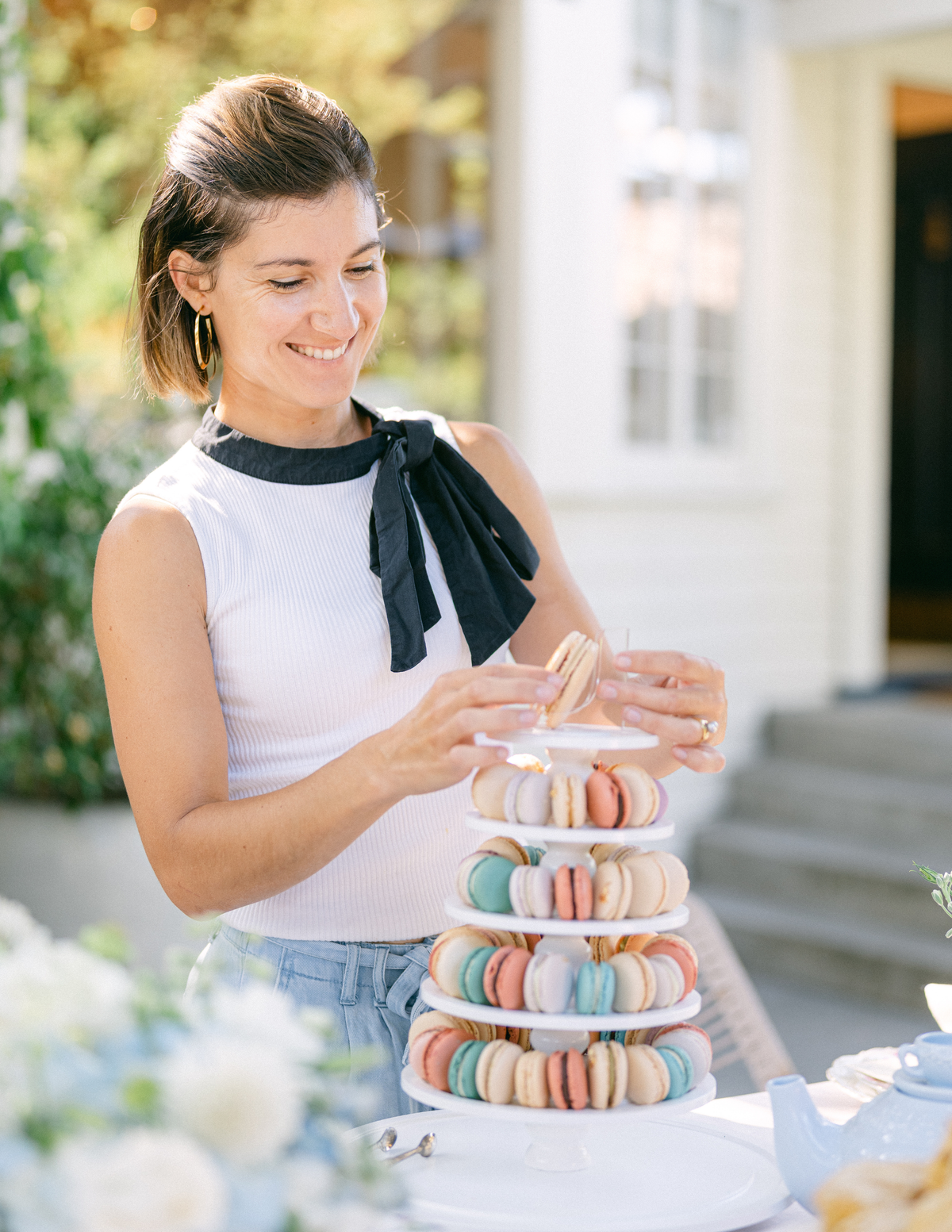 Julie Hutton, founder of Rêve, hand-piping French macarons in her Santa Barbara atelier